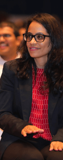 Tekion employee attentively listening to a presentation on the latest developments in automotive cloud solutions