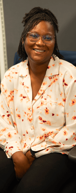 Tekion employee smiling, reflecting a positive workplace culture driven by cloud-native solutions